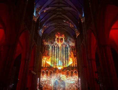 Interior of west door of York Minster, illuminated by the projection.