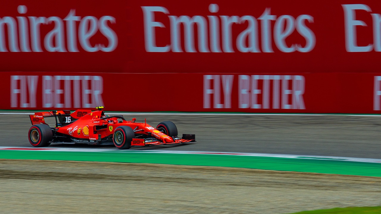 Red Racing Formula 1 Car Moving Around the track