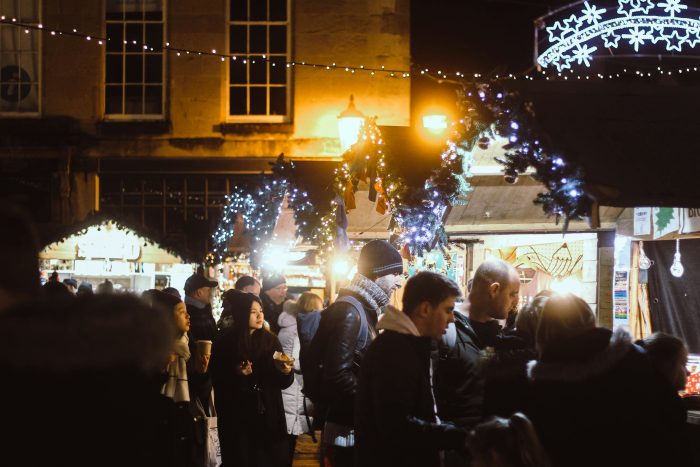 Christmas market with lights and people