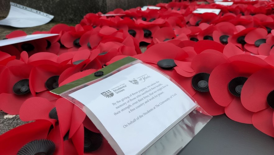 A Remembrance note from the University and YSU attached to a wreath in a series of wreaths.