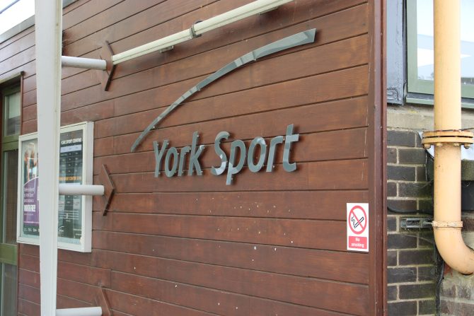 York Sport logo on a brick wall background