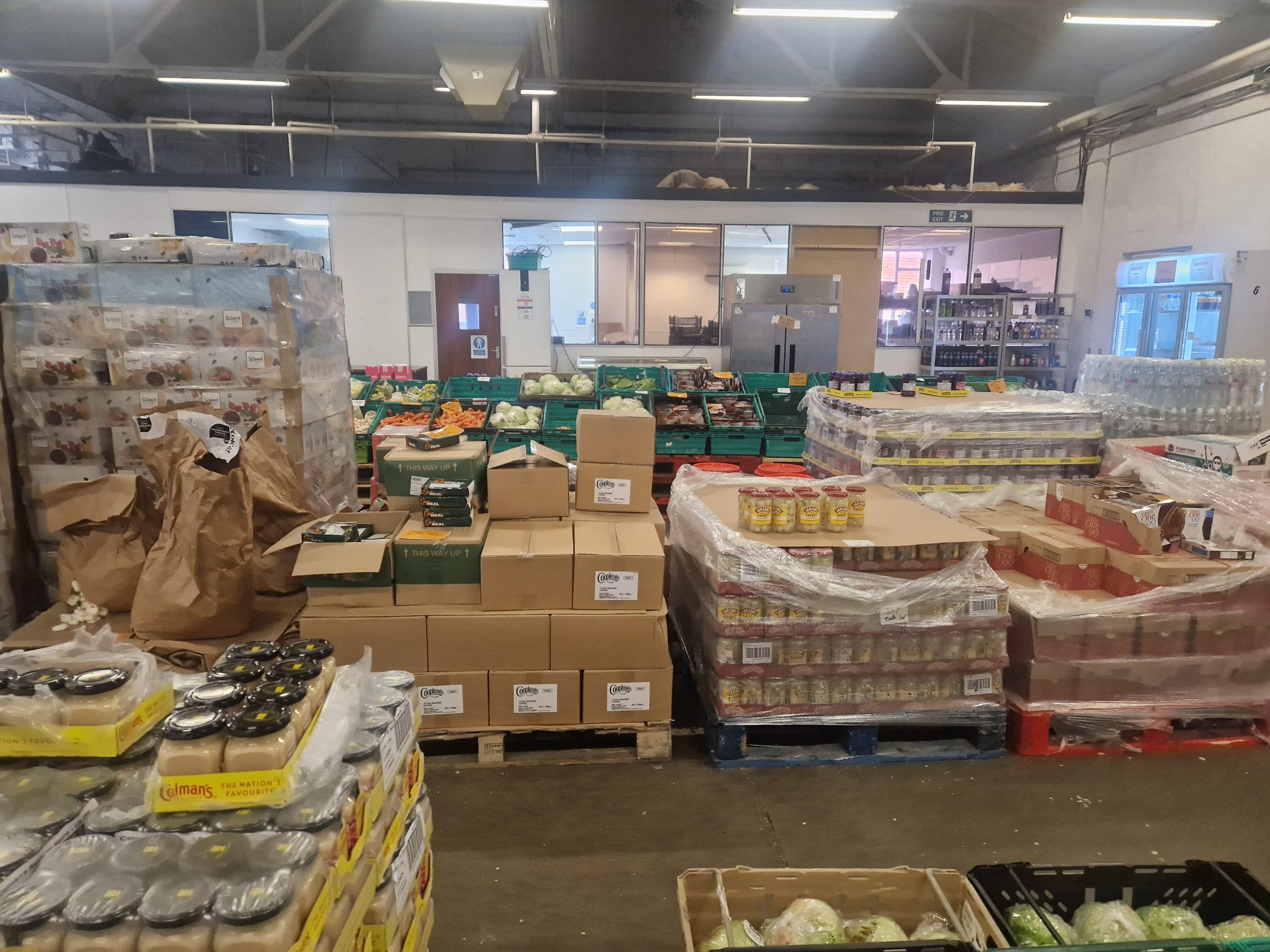 Stacks of surplus food in a warehouse.