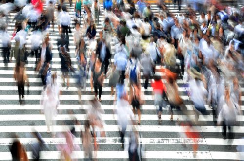 blur of pedestrians walking up steps